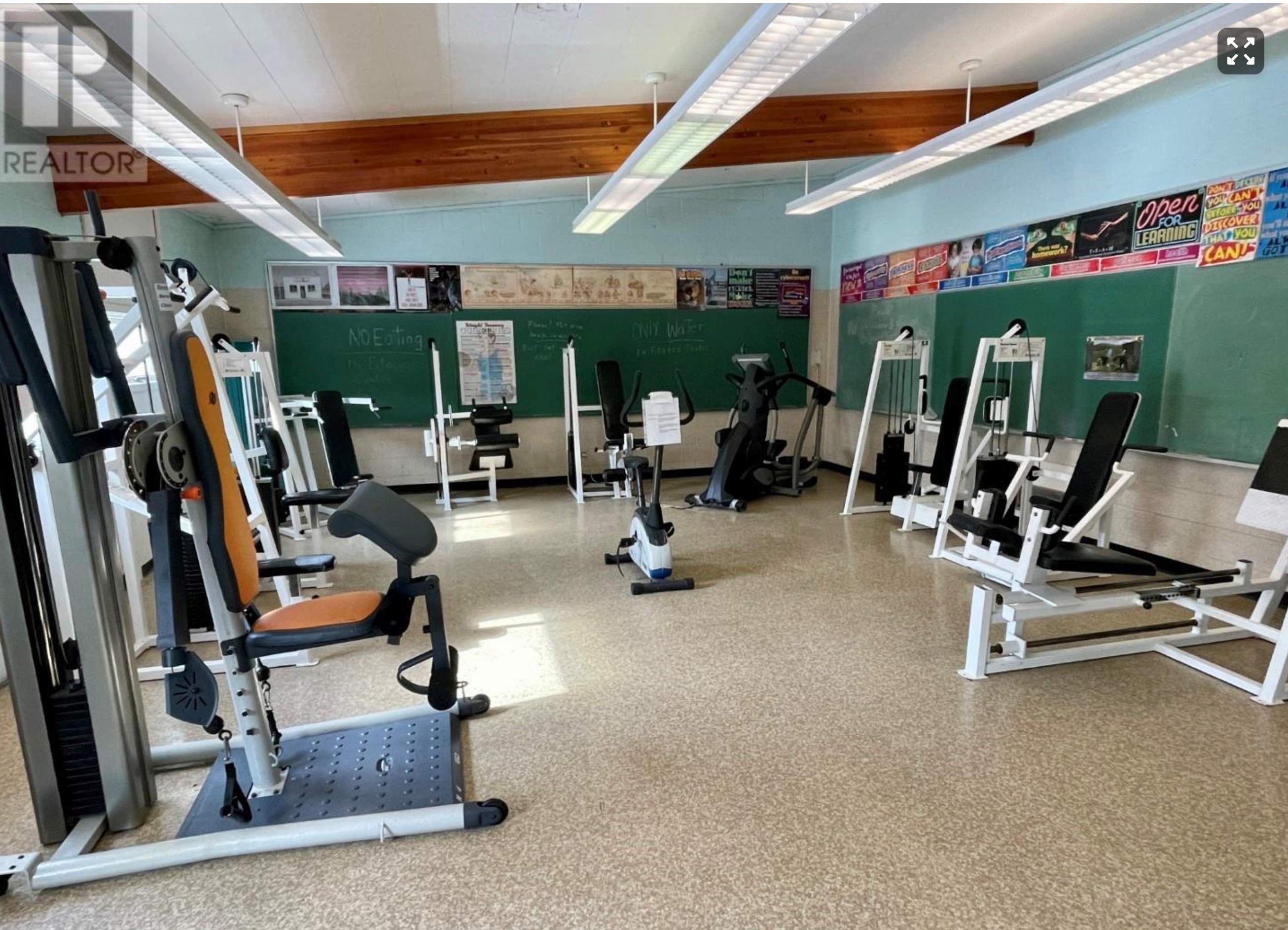 Existing fitness room with various exercise equipment already in place