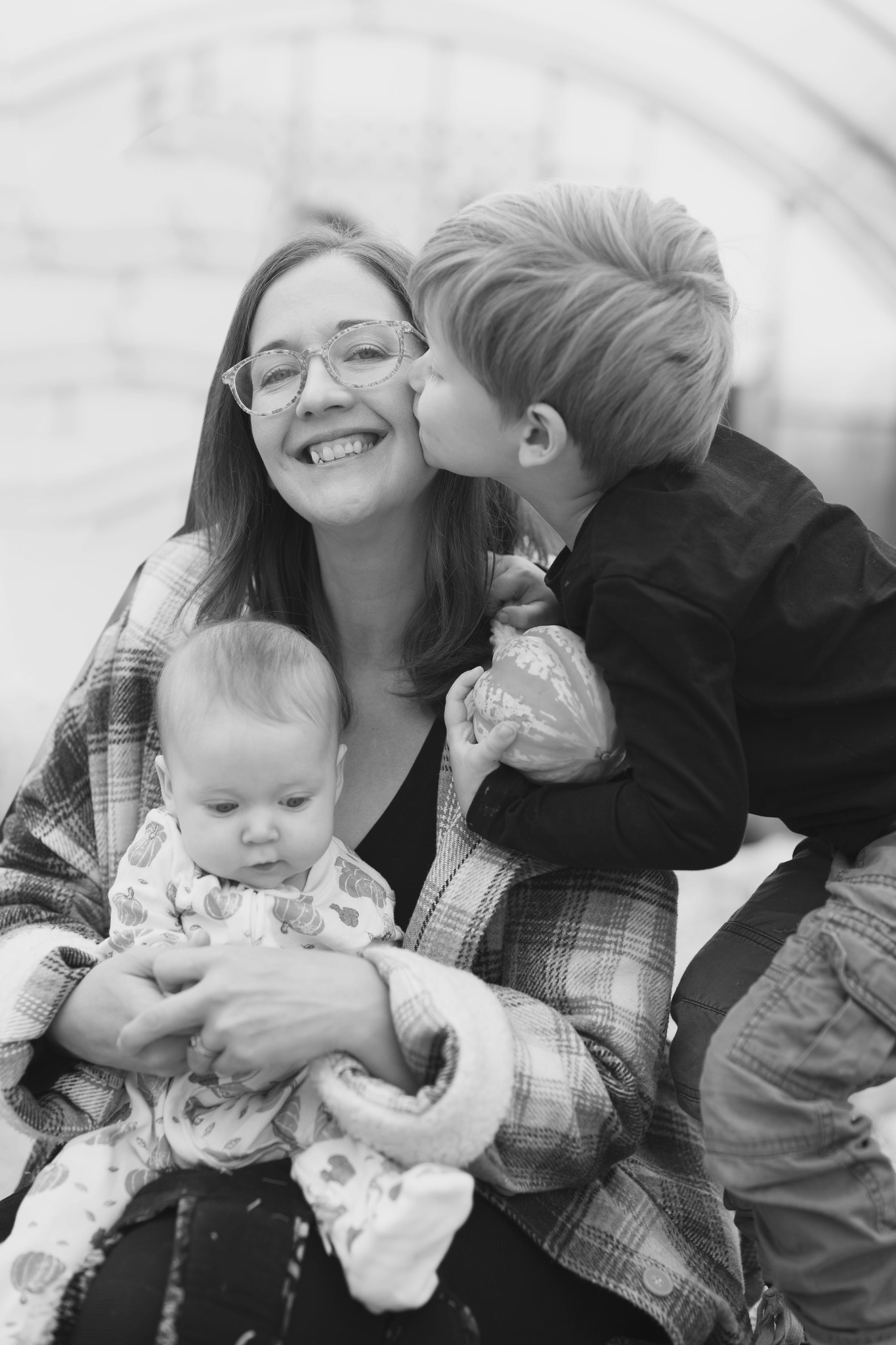 Black and white photo of mother with children