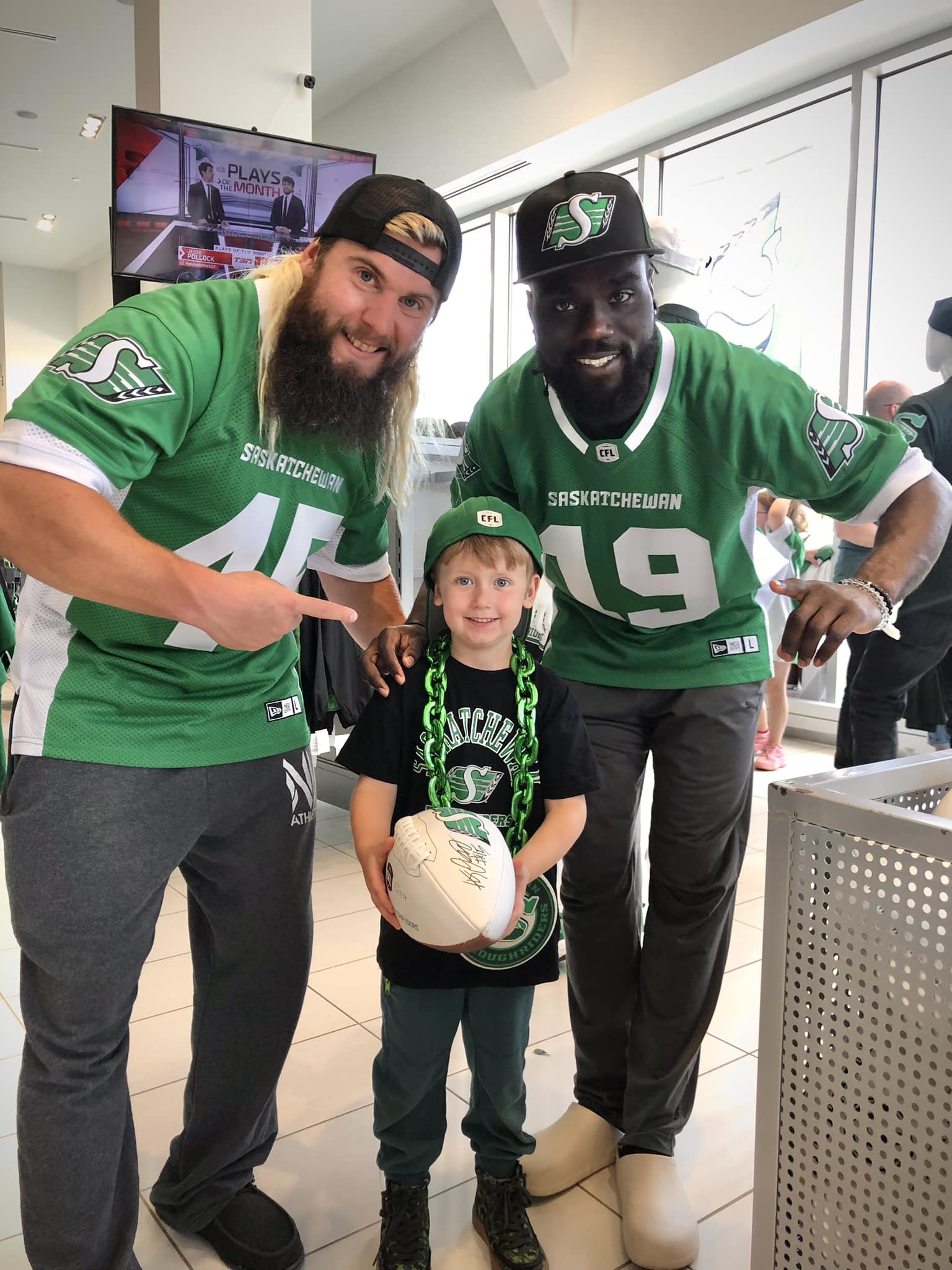 Family with Saskatchewan Roughriders players